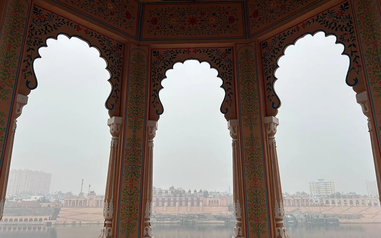 View of the Chambal riverfront in Kota through carved sandstone arches